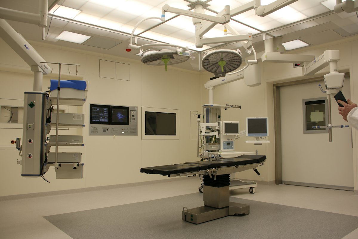 A prepared operating room with monitoring and imaging equipment